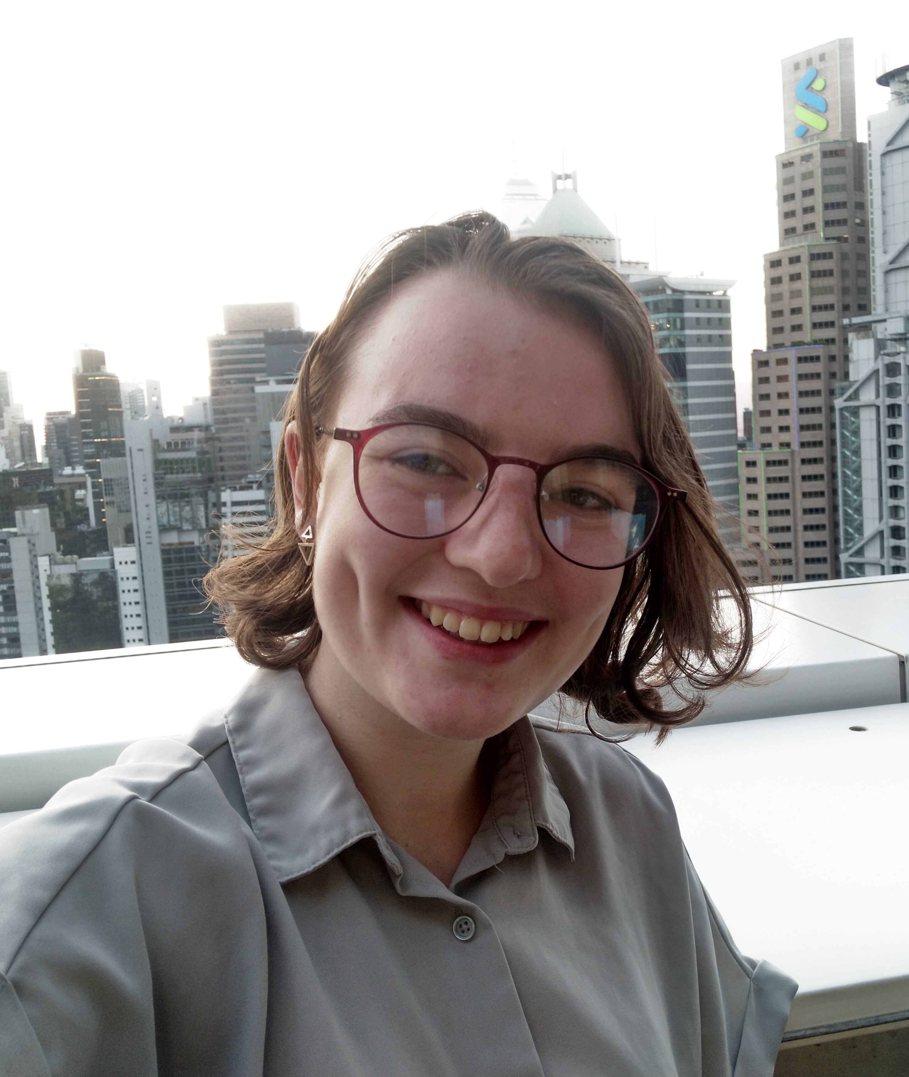 a photo of Molly in front of skyscrapers