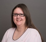 a portrait photo of karen on a grey background