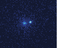 A 88Sr+ ion (left) and a 43Ca+ ion (right) trapped in the same trap.