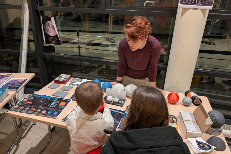 Image of attendees with DPhil student, Michelle Colantoni, at Observe the Moon Night 2025