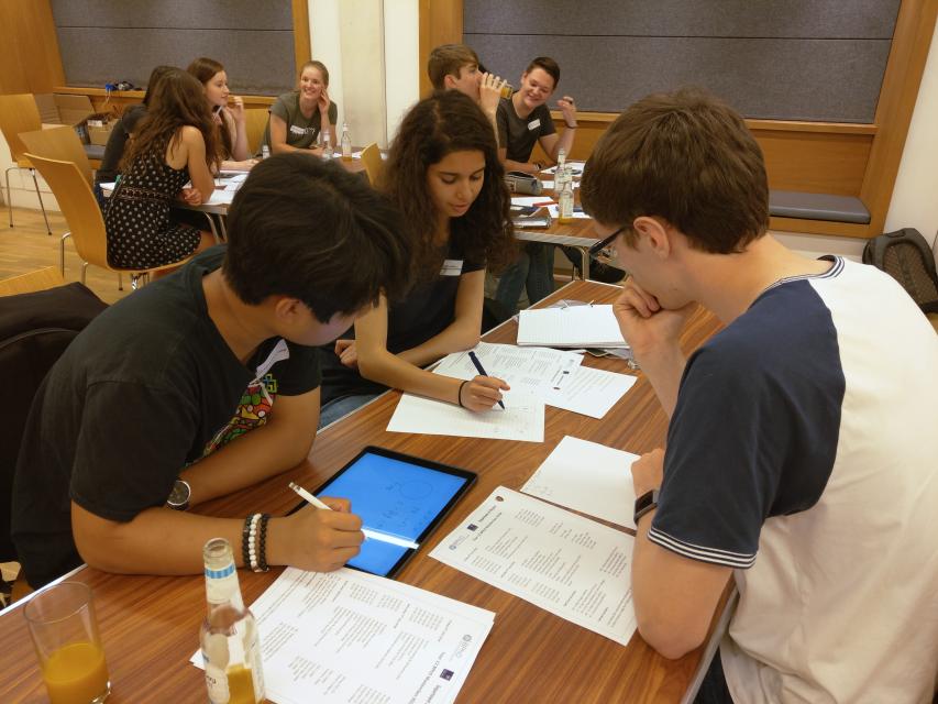 Students work on physics problems