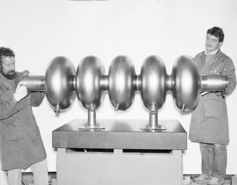 A picture of an early 5 celled superconducting RF cavity.