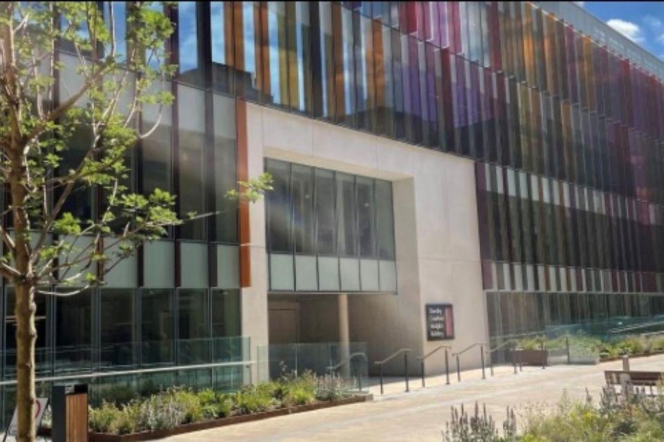 The image shows the front of the Dorothy Crowfoot Hodgkin Building, home of the Kavli Institute for Nanoscience Discovery