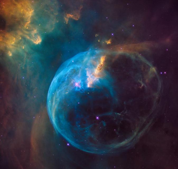 a photo by nasa of a bubble-shaped nebula