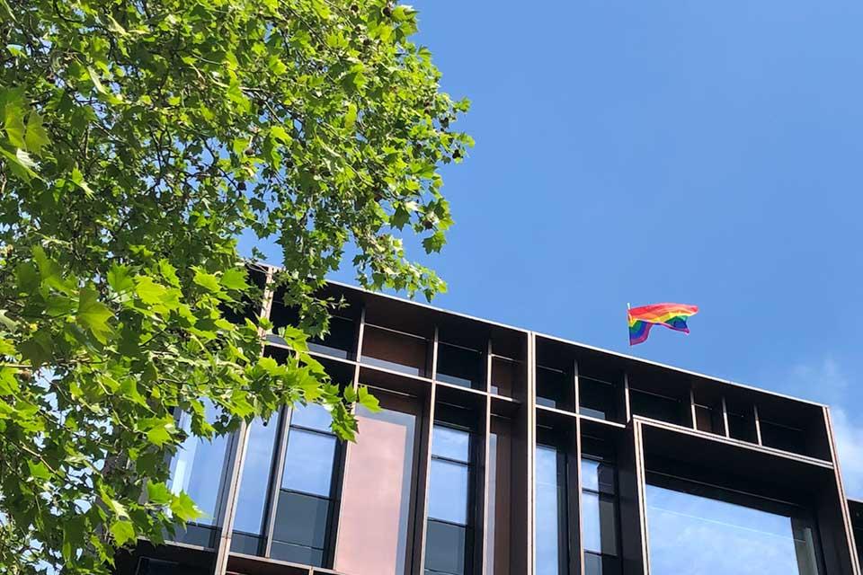 Pride flag flying above the Beecroft building