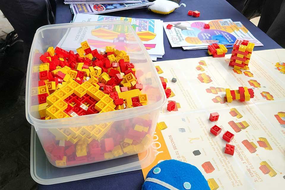 Using plastic bricks to demonstrate up and down quarks