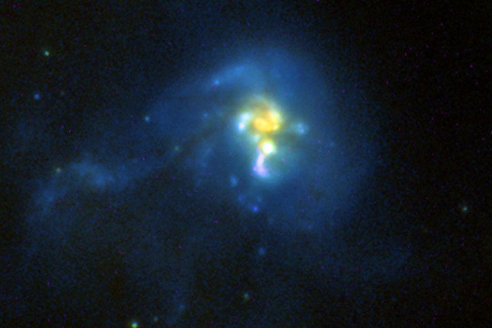 Image of an ultraluminous infrared galaxy taken  by the Advanced Camera for Surveys (ACS) and the revived Near Infrared Camera and Multi-Object Spectrometer (NICMOS).