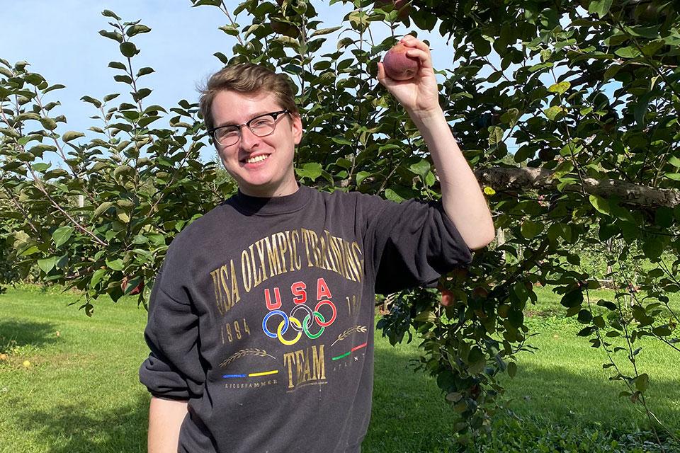 Dr Jake Taylor in apple orchard