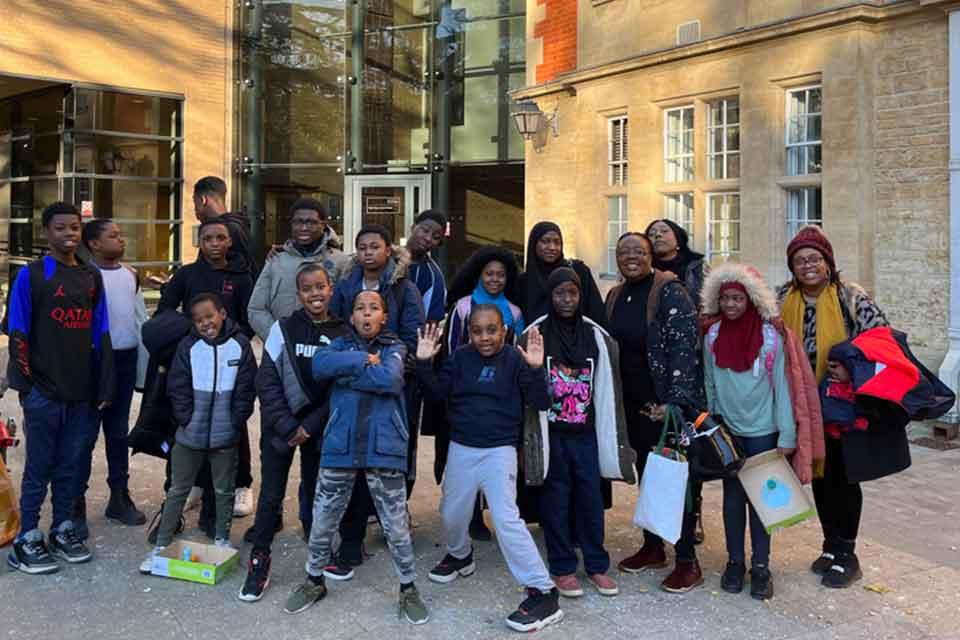Group of young people in front of the Department of Physics