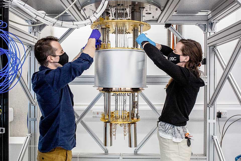 Two people with scientific instrument