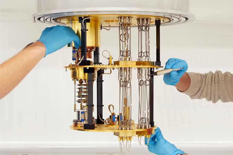 Hands around a scientific instrument