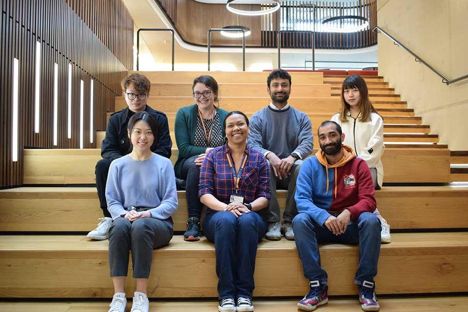 Dr Nakita Noel, centre front, and members of her research group in the Beecroft Building at the University of Oxford