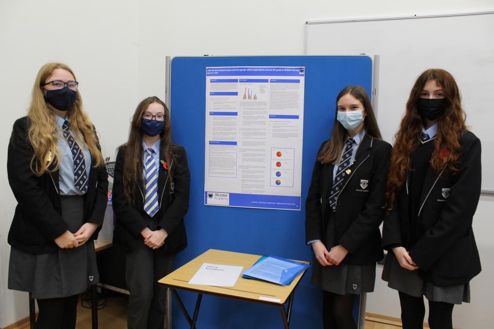 Students from Alcester Girls School with their poster