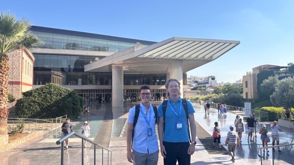Alex and Bradley standing outside the Acropolis Museum