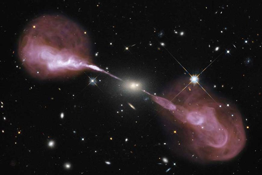 The Very Large Array sees fountains of hot gas erupting from a beastly black hole in the heart of a large galaxy known to radio astronomers as Hercules A. For millions of trillions of miles, these jets shoot through space, finally slowing when they reach ancient gaseous hiccups left behind by this galaxy’s earliest days of star-forming fury.