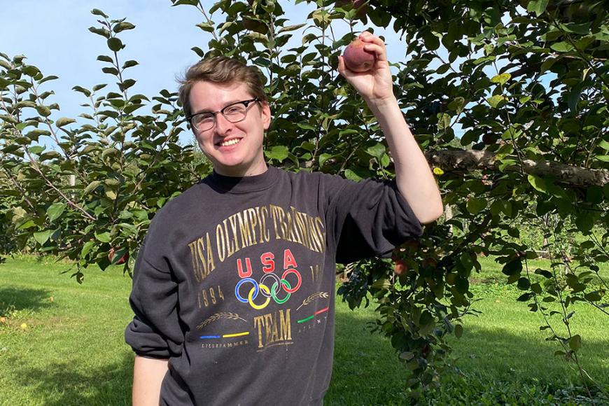 Dr Jake Taylor in apple orchard