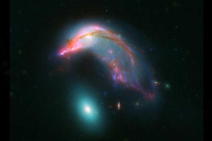 Distant interacting galaxies, known collectively as Arp 142.
