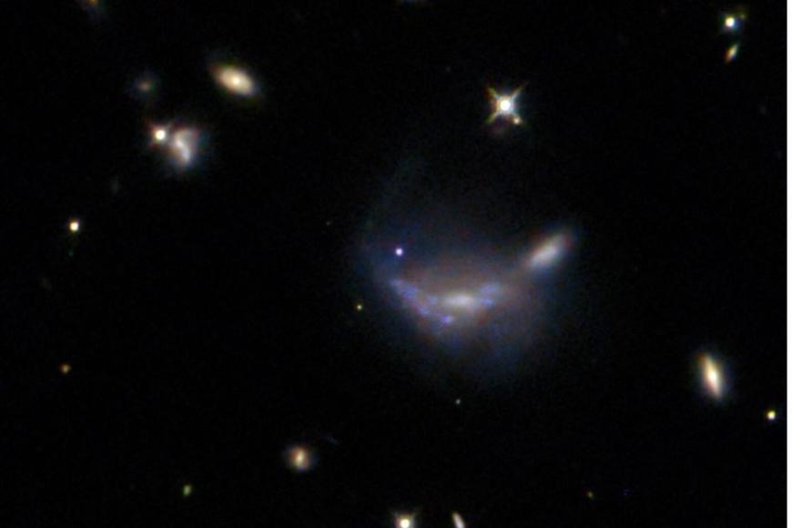 Type Ia supernova visible as a blue dot at the centre of this NASA/ESA Hubble Space Telescope image
