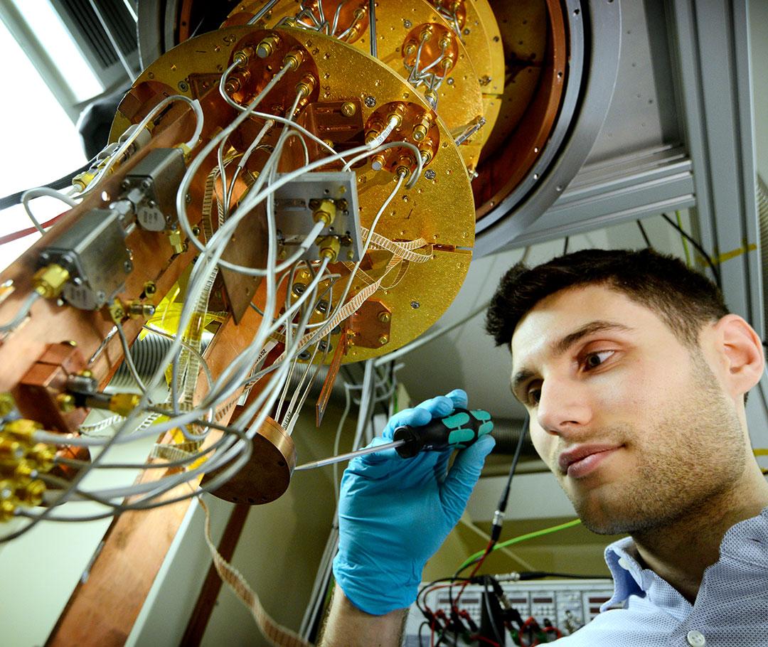 Male scientist working with scientific instrument