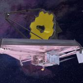 James Webb Telescope seen from its left (or port) side. This view shows part of the bottom of the telescope’s multi-layered sunshield, primary mirror, and mirror support struts.