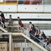 An image of students ascending metal staircase at RAL. 