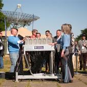 Members of the partnership standing around the phased array feed (PAF).