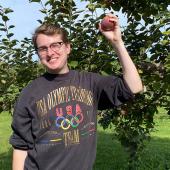 Dr Jake Taylor in apple orchard