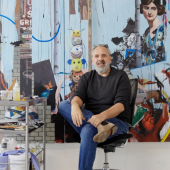 Keith Tyson in front of painting artwork. 