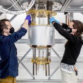 Two people with scientific instrument
