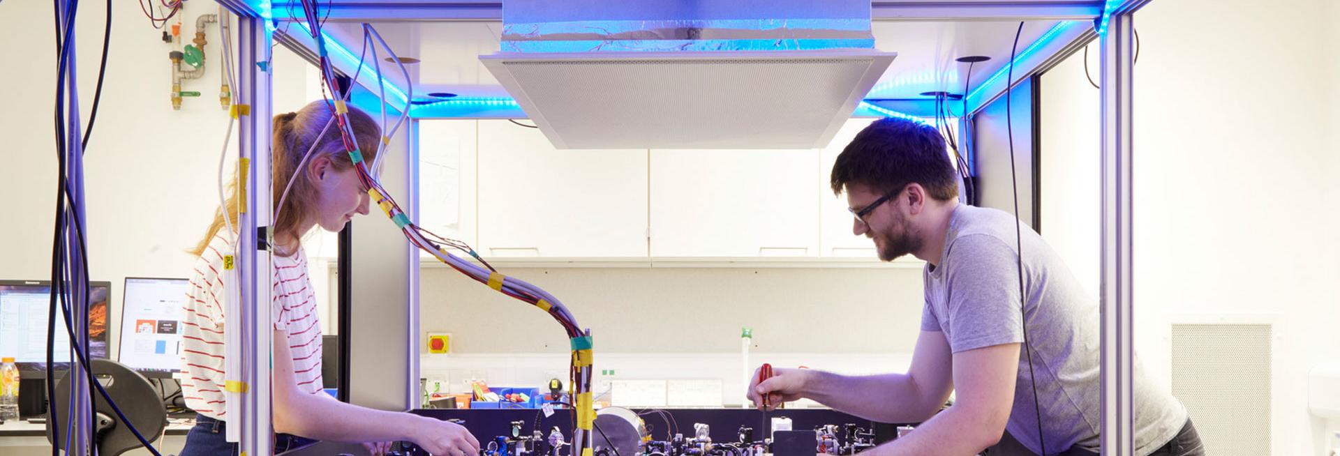 Man and woman with scientific instruments