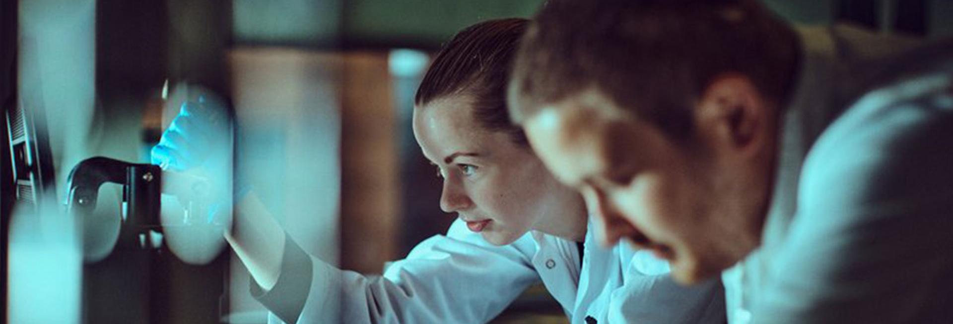 A male and female scientist at work