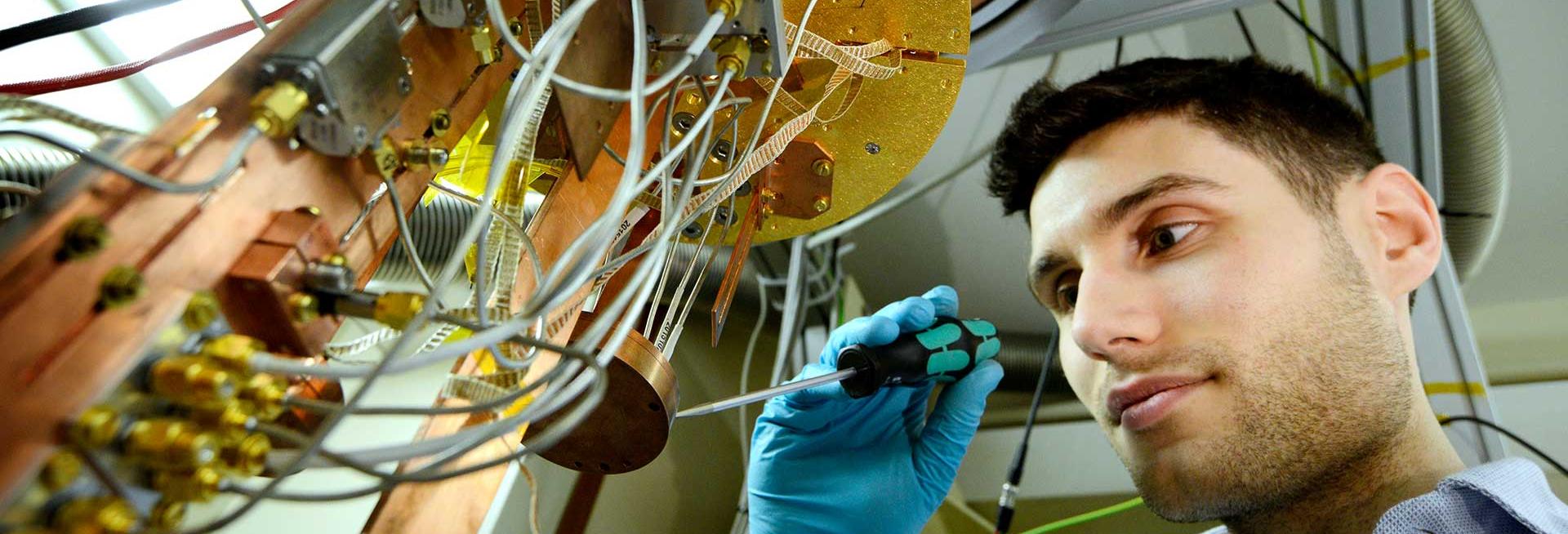 White male with scientific instrument