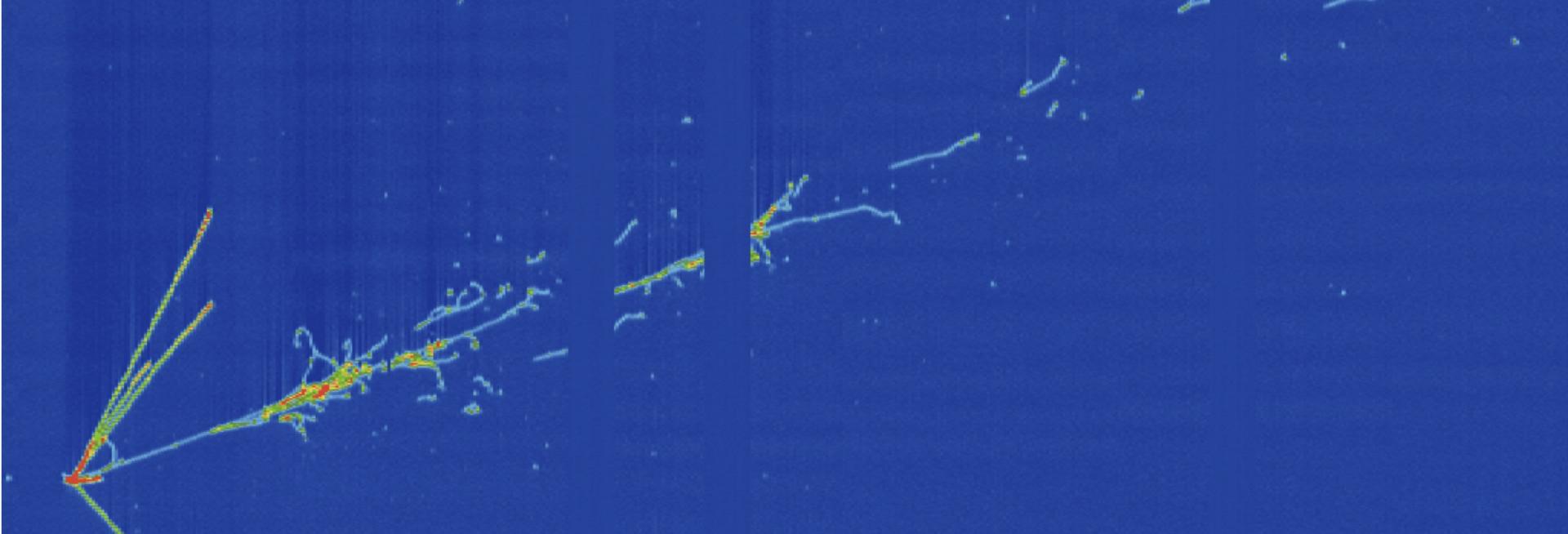 An event display from the MicroBooNE detector, showing a candidate electron neutrino interaction from the NuMI beam. One long shower (a candidate electron) is seen, with a number of shorter tracks (candidate protons and/or charged pions)