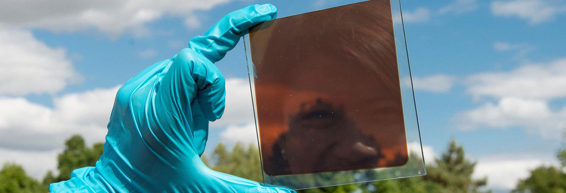 Hand holding solar cell