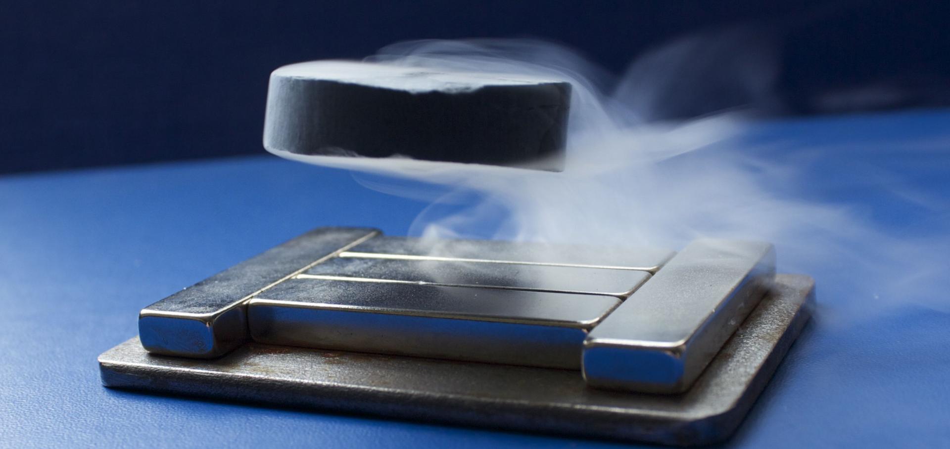 High temperature superconducting disk levitating above a slab of permanent magnets