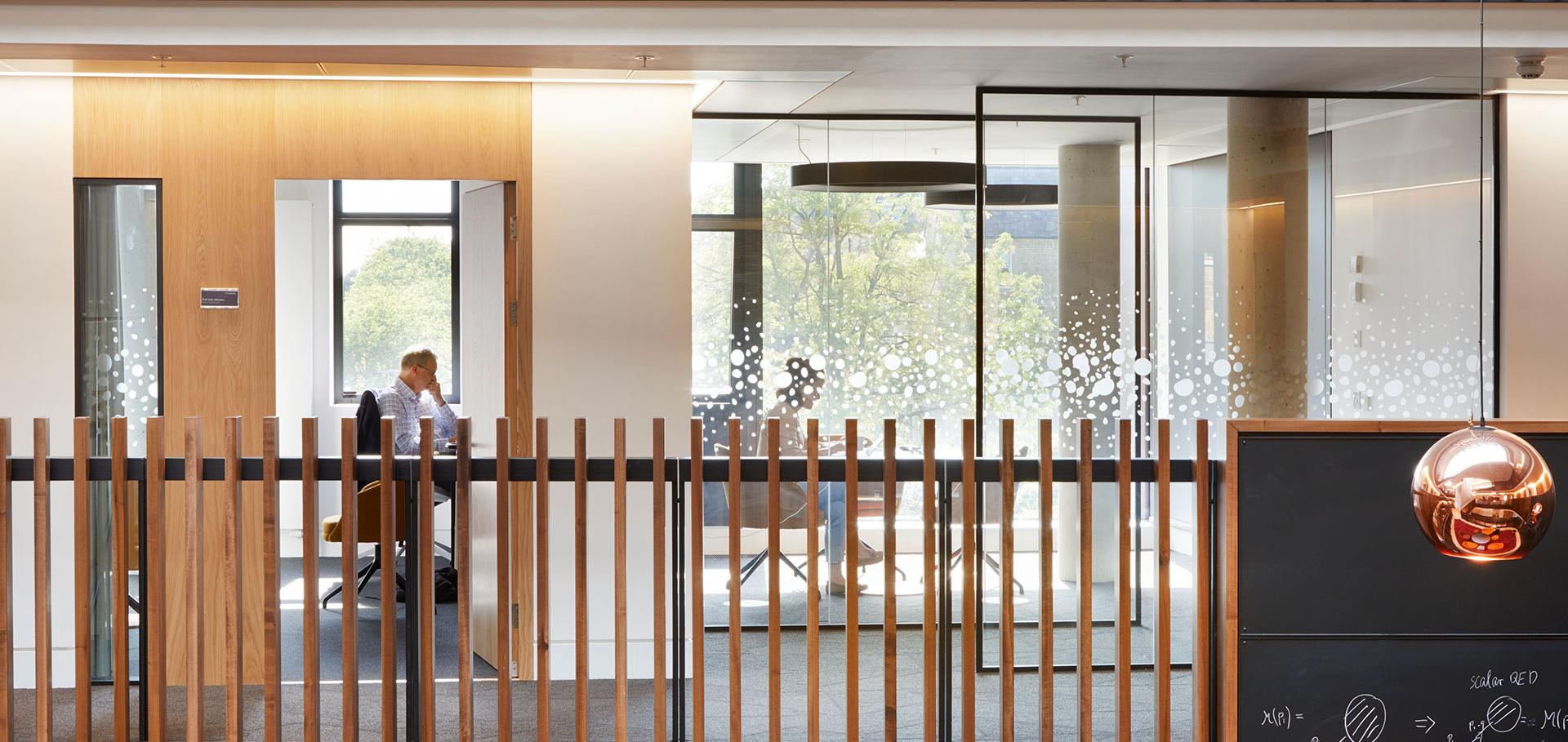 Man at desk in office, Beecroft building, University of Oxford