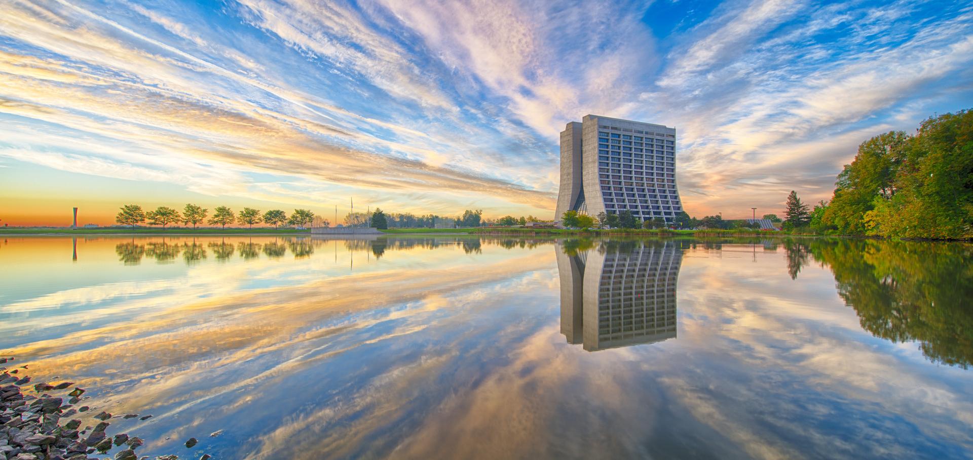 Wilson Hall at Fermilab with reflection at sunrise.