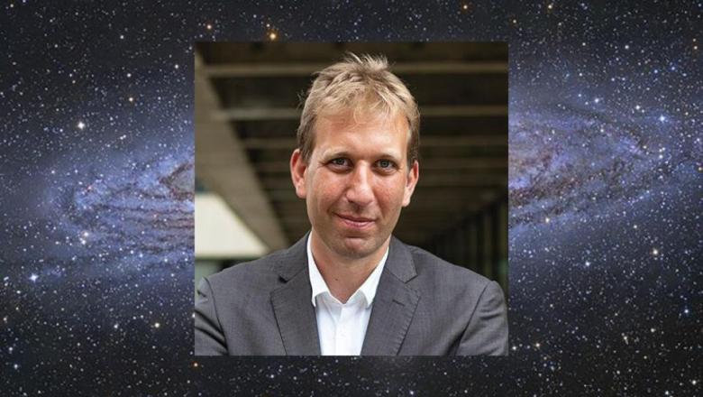Image shows a galaxy with a super imposed portrait of Professor Chris Lintott
