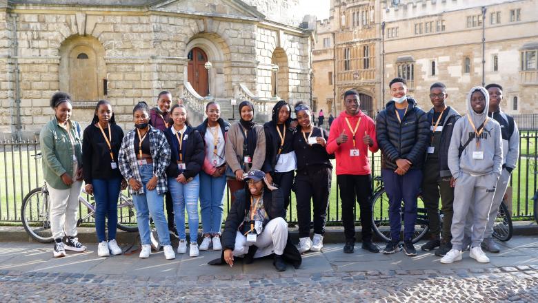 a photo of a group of young Black students in front of the Radcliffe Camera in Oxford