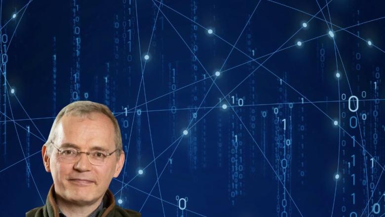 A portrait of Professor Stephen Blundell with a generic background