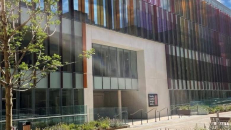 The image shows the front of the Dorothy Crowfoot Hodgkin Building, home of the Kavli Institute for Nanoscience Discovery