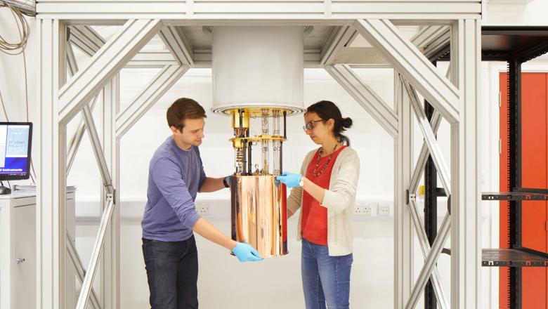 A male and female research scientist with scientific instrument