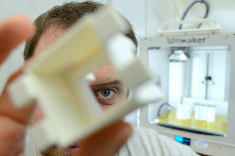 Man holding scientific instrument