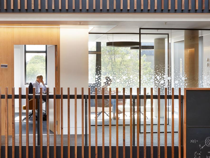 Man at desk in office, Beecroft building, University of Oxford